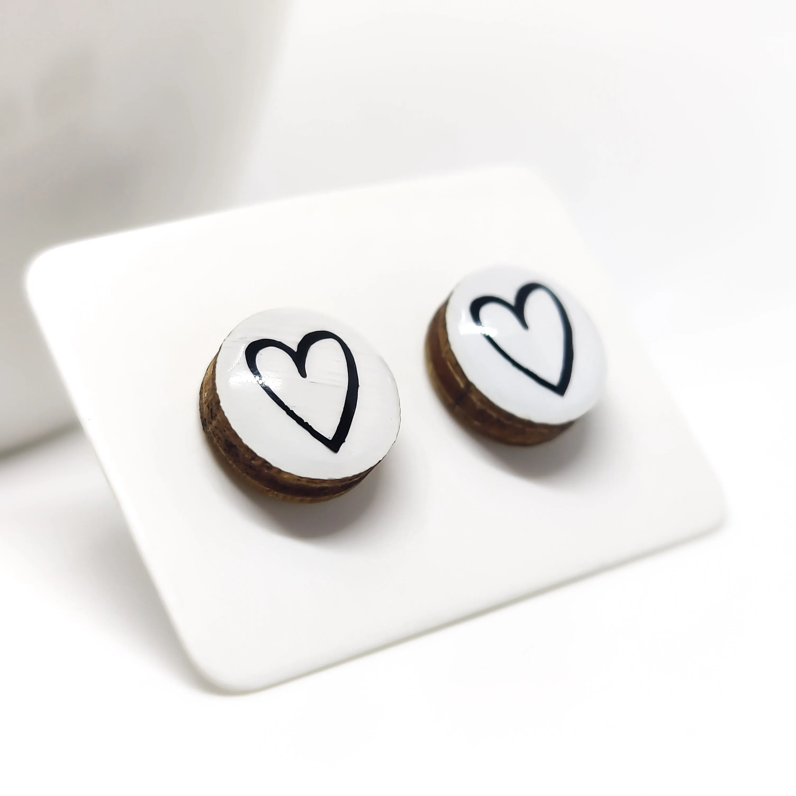 White & Black Hand Drawn Heart Stud Earrings by Candi Cove Designs